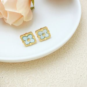 Delicate Earrings Studs with Gold Detailing in Blue EUR563