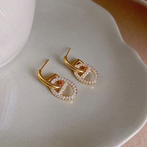 EUR436 crystal pig nose earrings in Gold