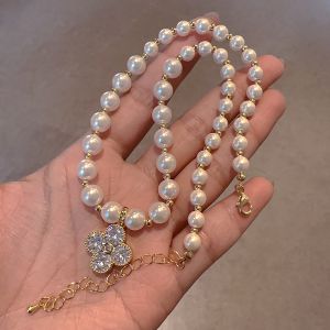 EUR410 four petal crystal flower drop pearl necklace in Ivory
