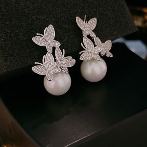 EUR418 triple Butterflies and pearl earrings in Silver