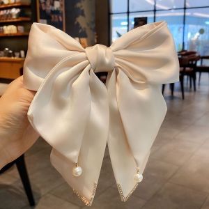 SS51 Satin hair bow clip with large pearl detail in Beige