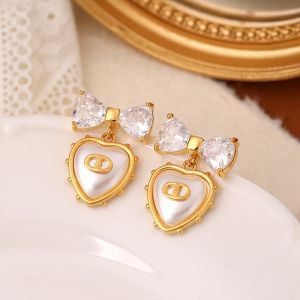 Bowknot & Heart Drop Earrings with Pearl in Ivory EUR566