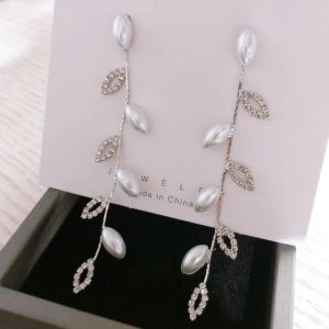 EUR320 delicate pearl and crystal leaves earrings in Silver