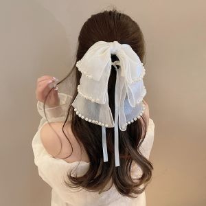 SS49 Silky layers hair bow with pearl details in Cream