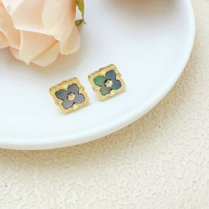 Delicate Earrings Studs with Gold Detailing in Grey EUR563