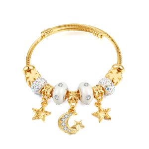 EUR373 Moon and stars bangle in Gold