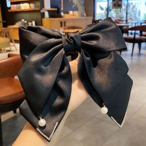 SS51 Satin hair bow clip with large pearl detail in Black