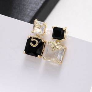 Geometric Number 5 Dangle Earrings in Gold/Black EUR575