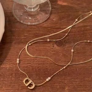 Letter and Pearl Detailed Necklace in Gold